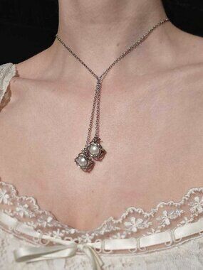 Vintage silver asymmetrical tie neckalce with white pearls